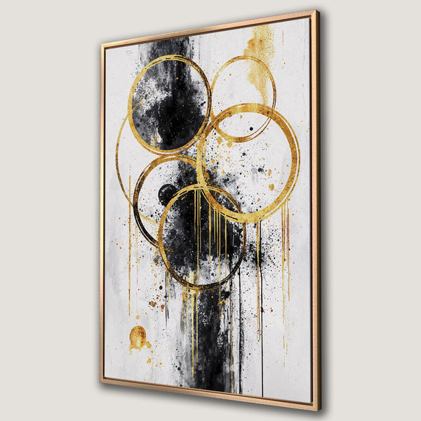 Framed Wall Art featuring abstract gold circle design on white canvas. Modern art with black and gold color palette, perfect for home decor.