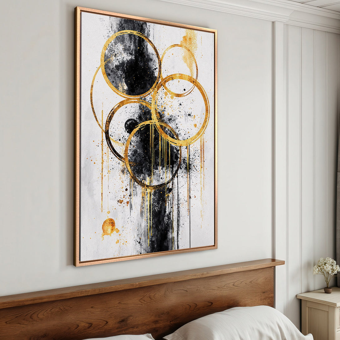 Framed Wall Art: Abstract gold and black circles on white canvas. Modern art print, perfect for bedroom decor. Neutral color palette.