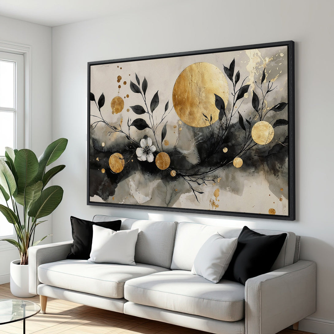 Framed Wall Art featuring an abstract floral design in gold, black, and neutral tones, displayed in a modern interior.