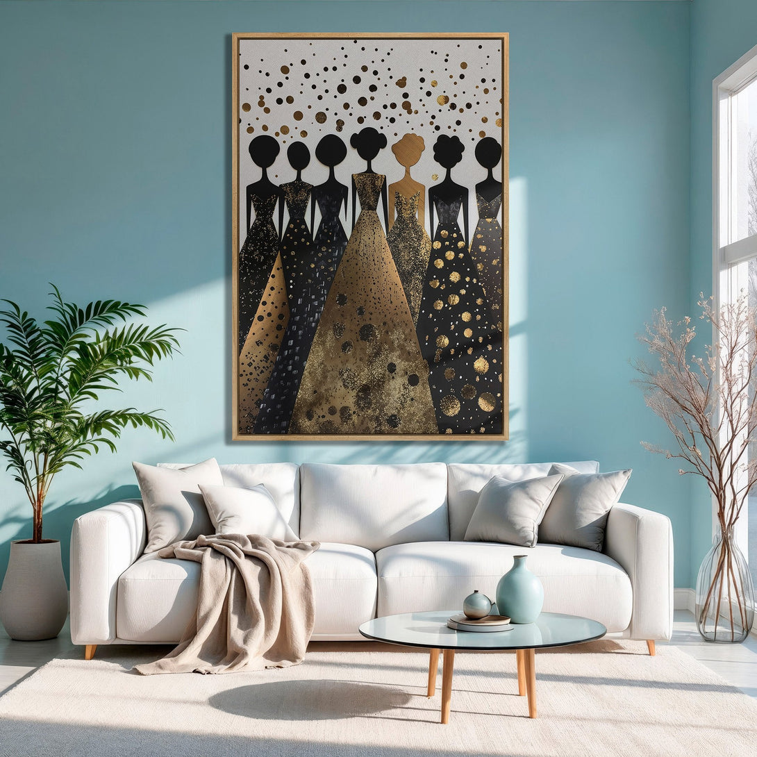 Framed Wall Art of elegant women in black and gold dresses, displayed in a modern living room with a teal and gold color palette.