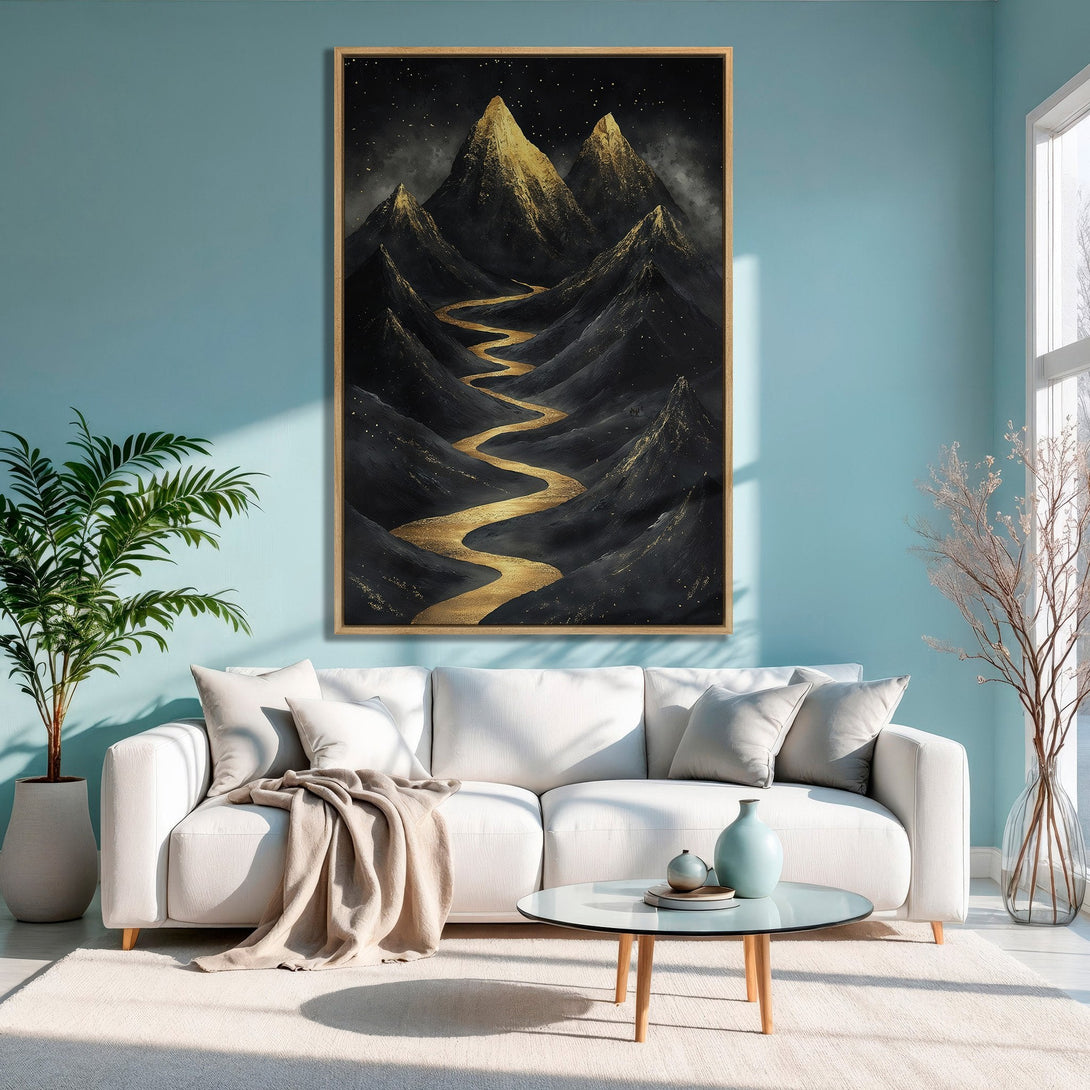Framed Wall Art: Abstract mountain landscape in gold and black, modern style, displayed in a living room with a teal wall.