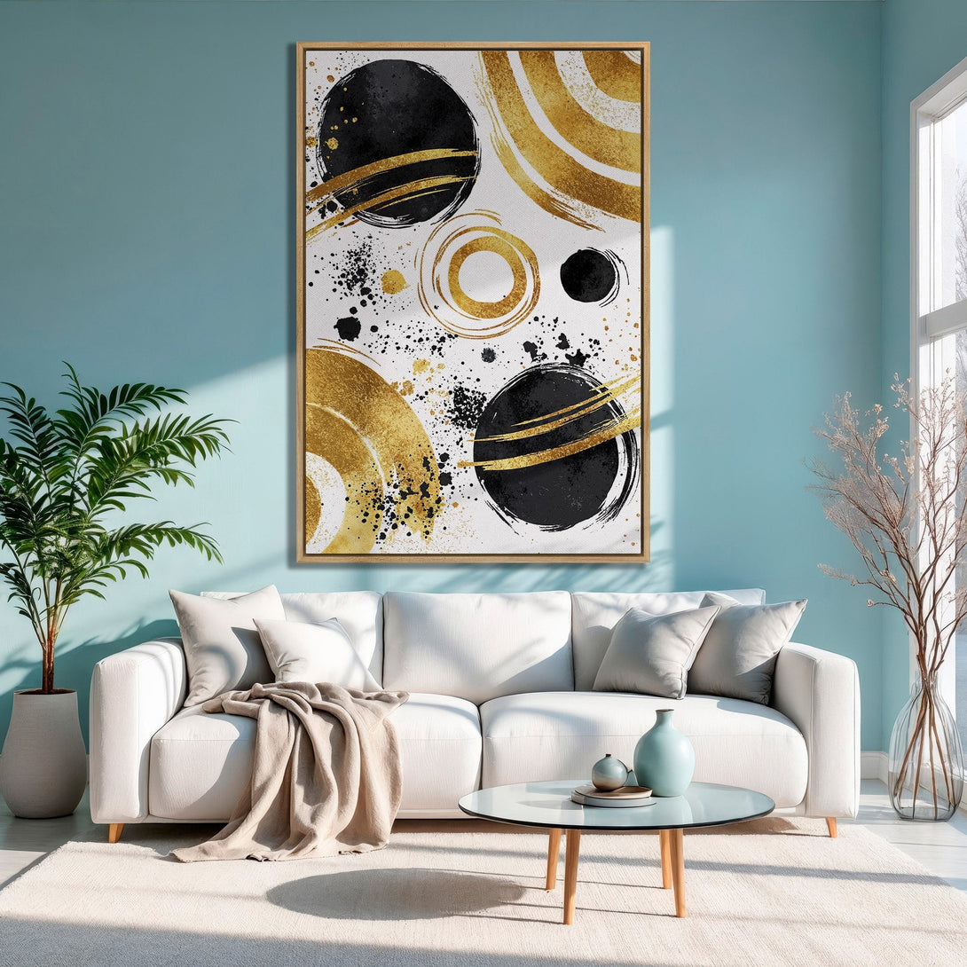 Framed Wall Art: Abstract gold and black brushstroke design canvas print, modern style, displayed in a living room with a blue and white color palette.