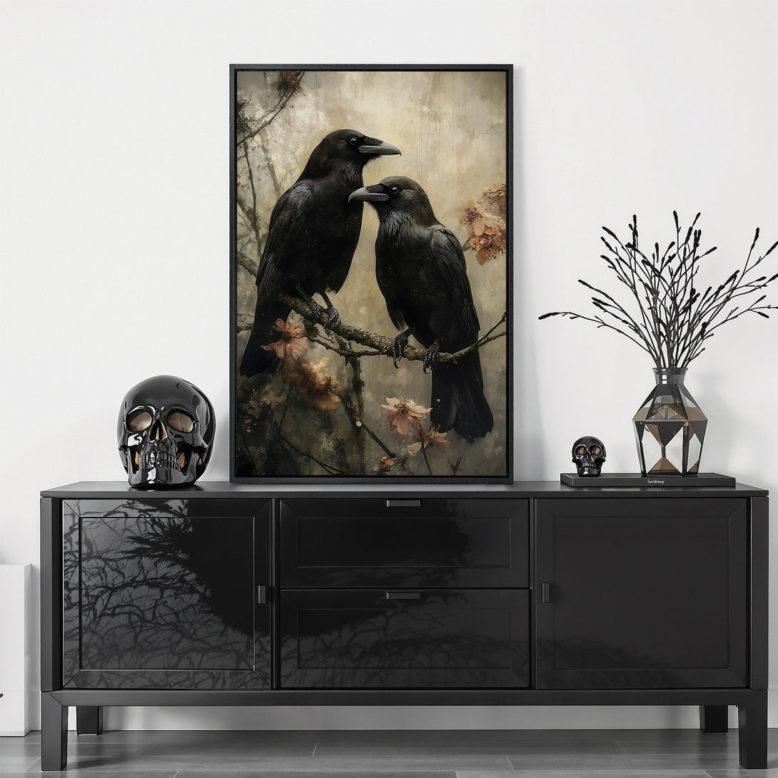 Framed Wall Art featuring two black crows on a branch. Moody, gothic style with a muted neutral and black color palette. Perfect for adding a touch of dark elegance.
