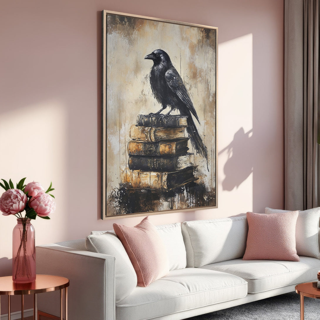 Framed Wall Art: Black raven perched on books, abstract style. Earthy tones with a pop of pink in a cozy living room setting.