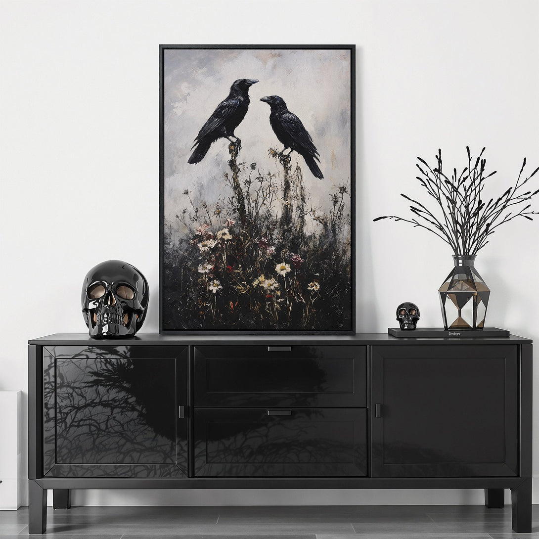Framed Wall Art featuring two black ravens on a branch. Moody, gothic style with a neutral, grayscale palette. Elevate your space with this unique artwork!