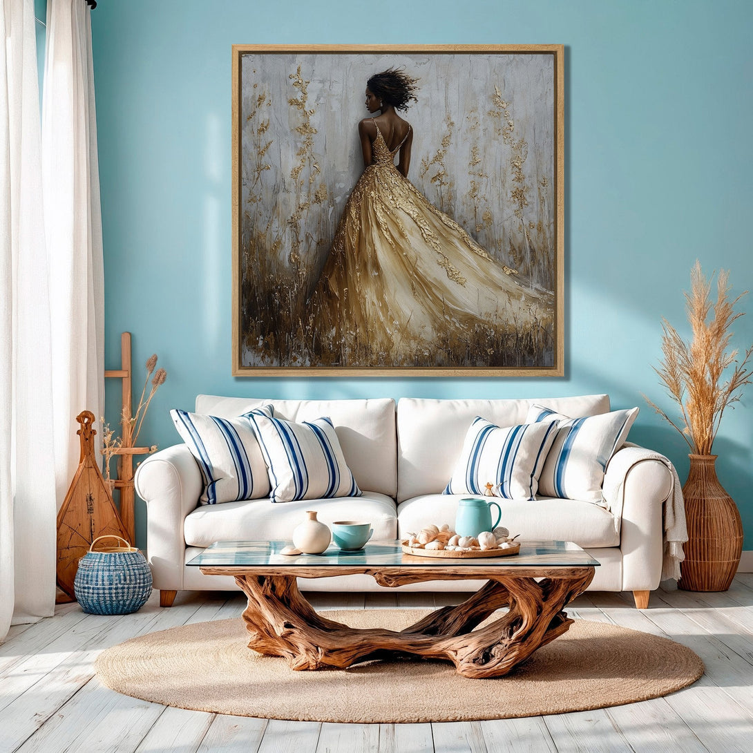 Framed Wall Art: Elegant woman in gold dress, abstract style, displayed in a coastal living room. Features a neutral & gold color palette for a sophisticated look.