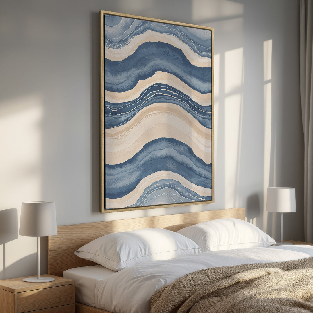 Framed Wall Art in a bedroom. Abstract blue and beige wave design. Modern art canvas print perfect for adding a touch of elegance to your space.
