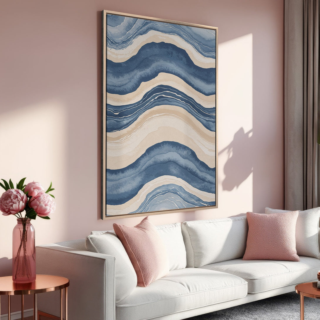 Framed Wall Art featuring abstract blue and beige waves. Modern art print adds a calming touch to any interior. Shop our canvas prints for stylish home decor!