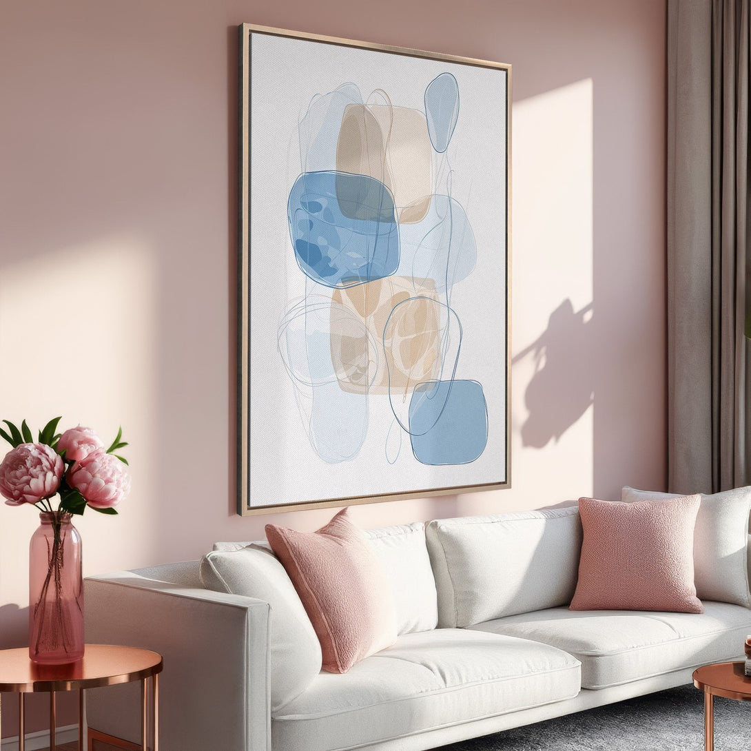 Framed Wall Art featuring abstract shapes in blue and beige tones. Modern canvas print adds a touch of elegance to any living room decor.