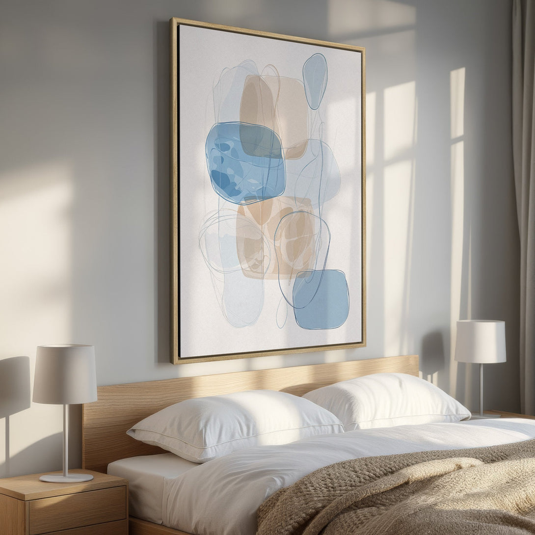 Framed Wall Art: Abstract art in blue and beige tones. Modern canvas print adds a stylish touch to a bedroom interior. Shop now for unique wall decor!