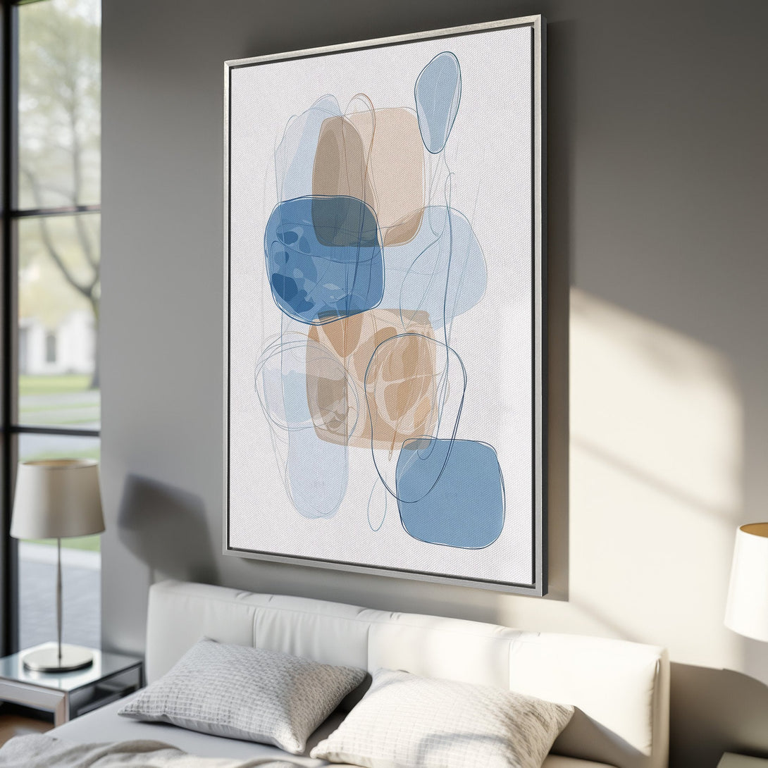 Framed Wall Art: Abstract art in blue and tan tones. Modern canvas print adds a touch of elegance to any interior. Shop now for stylish wall decor!