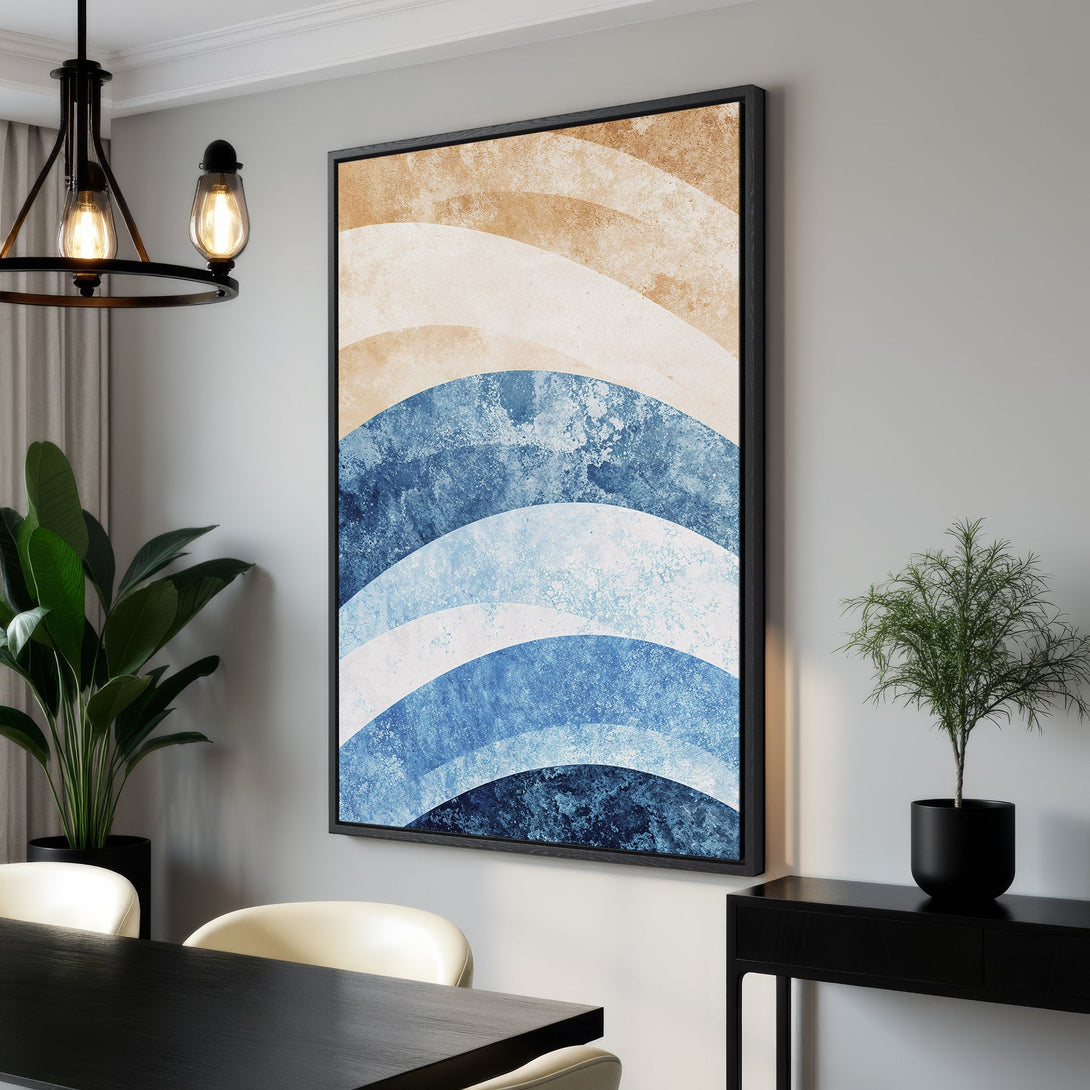 Framed Wall Art featuring abstract blue and beige waves. Modern art canvas print adds coastal style to any room. Shop now for unique wall decor!