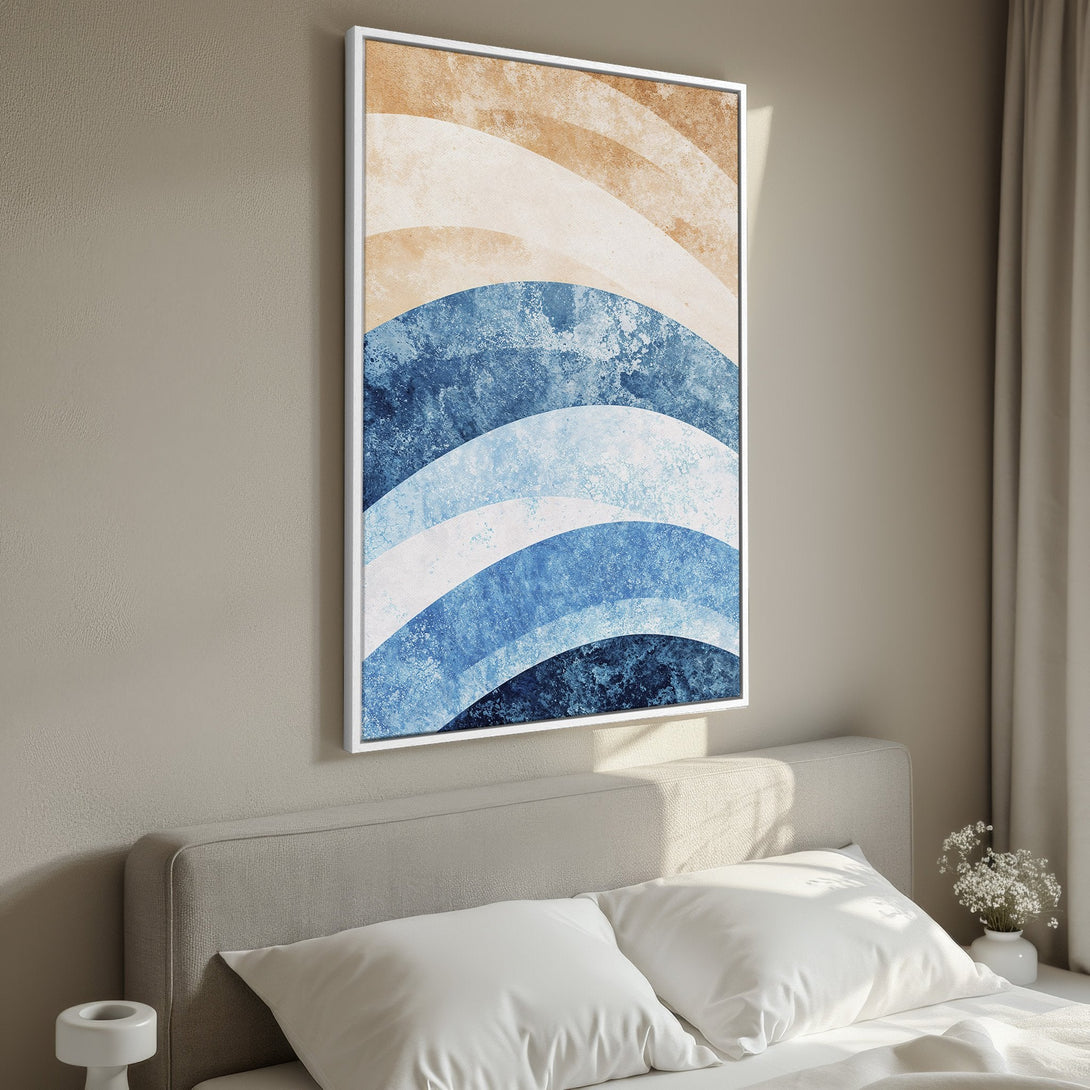 Framed Wall Art featuring abstract blue and beige waves. Modern art canvas print adds a touch of coastal style to your bedroom decor.