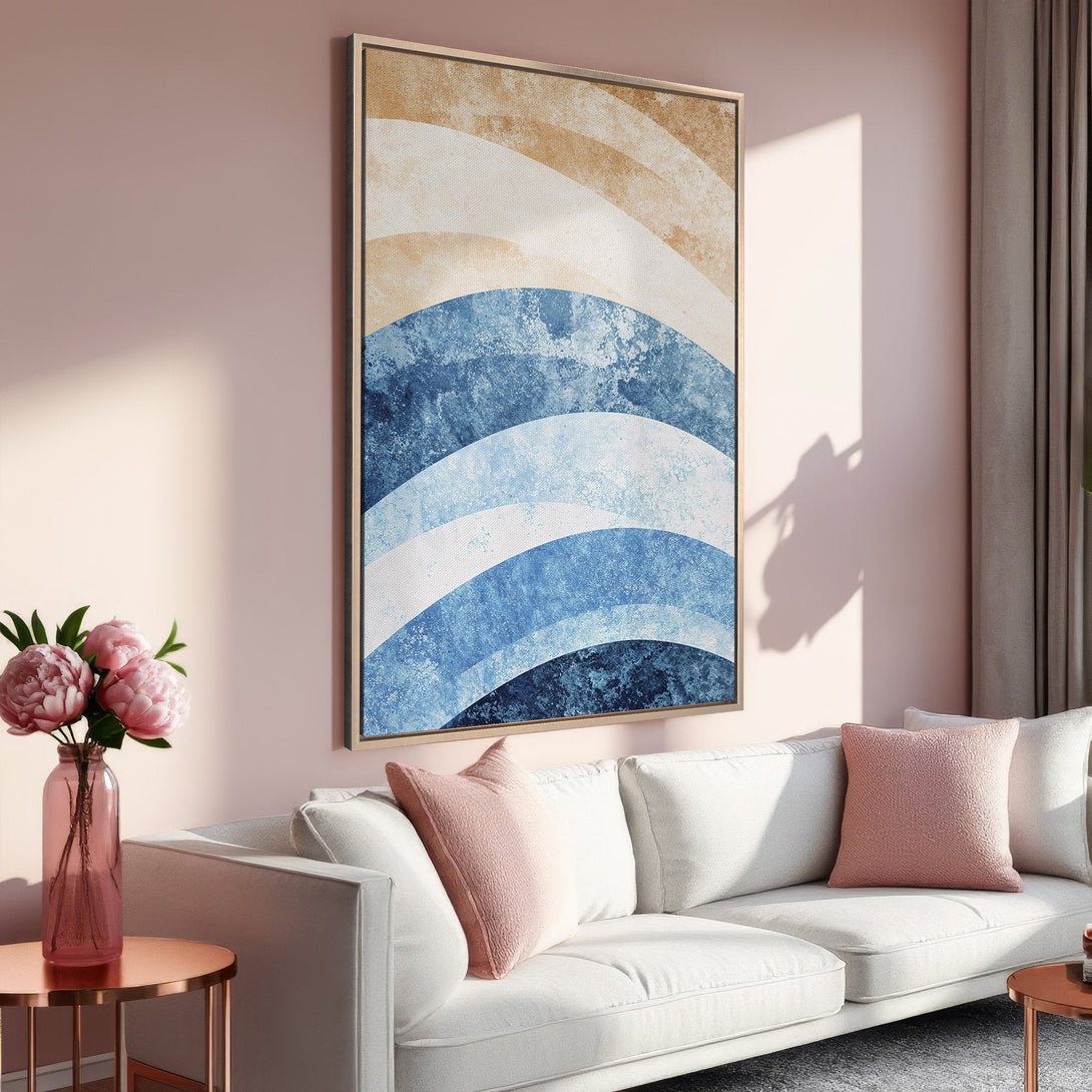 Framed Wall Art featuring abstract blue and beige waves. Modern art print with a warm, inviting color palette, perfect for living room decor.