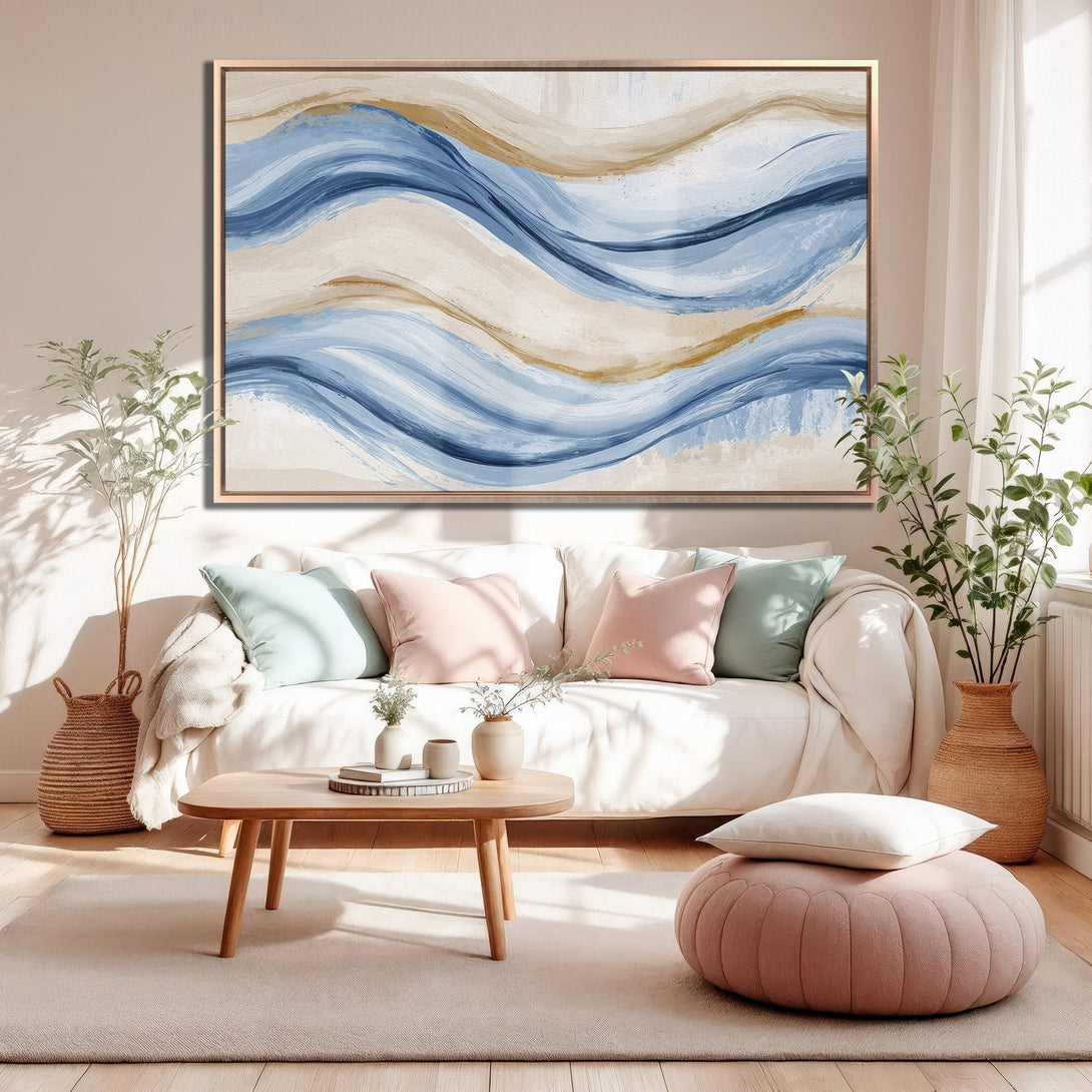 Framed Wall Art featuring abstract wave art in blue, gold, and beige tones. Perfect for adding a touch of modern elegance to your living room.