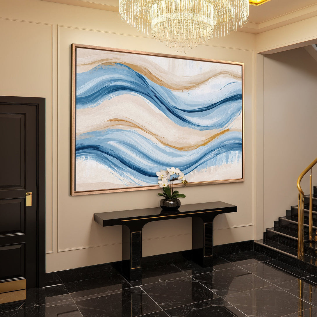 Framed Wall Art: Abstract blue and gold canvas print adds elegance to a modern entryway. Enhance your space with this stunning artwork.