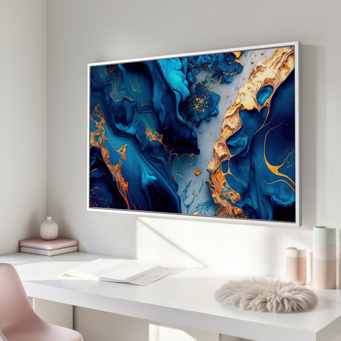 Framed Wall Art featuring an abstract blue and gold design. Modern art canvas print with a luxurious and elegant color palette. Perfect for home decor.