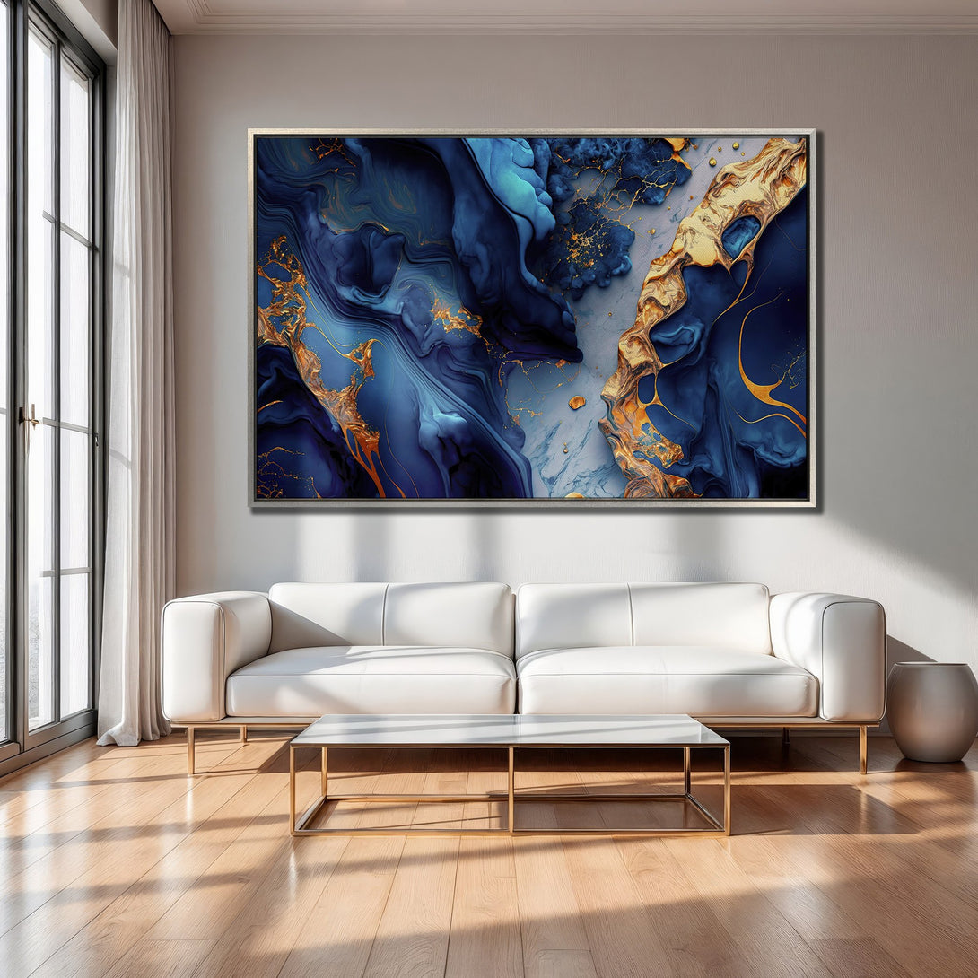 Framed Wall Art: Abstract blue and gold artwork displayed in a modern living room. Enhance your decor with this stunning Canvas Print!