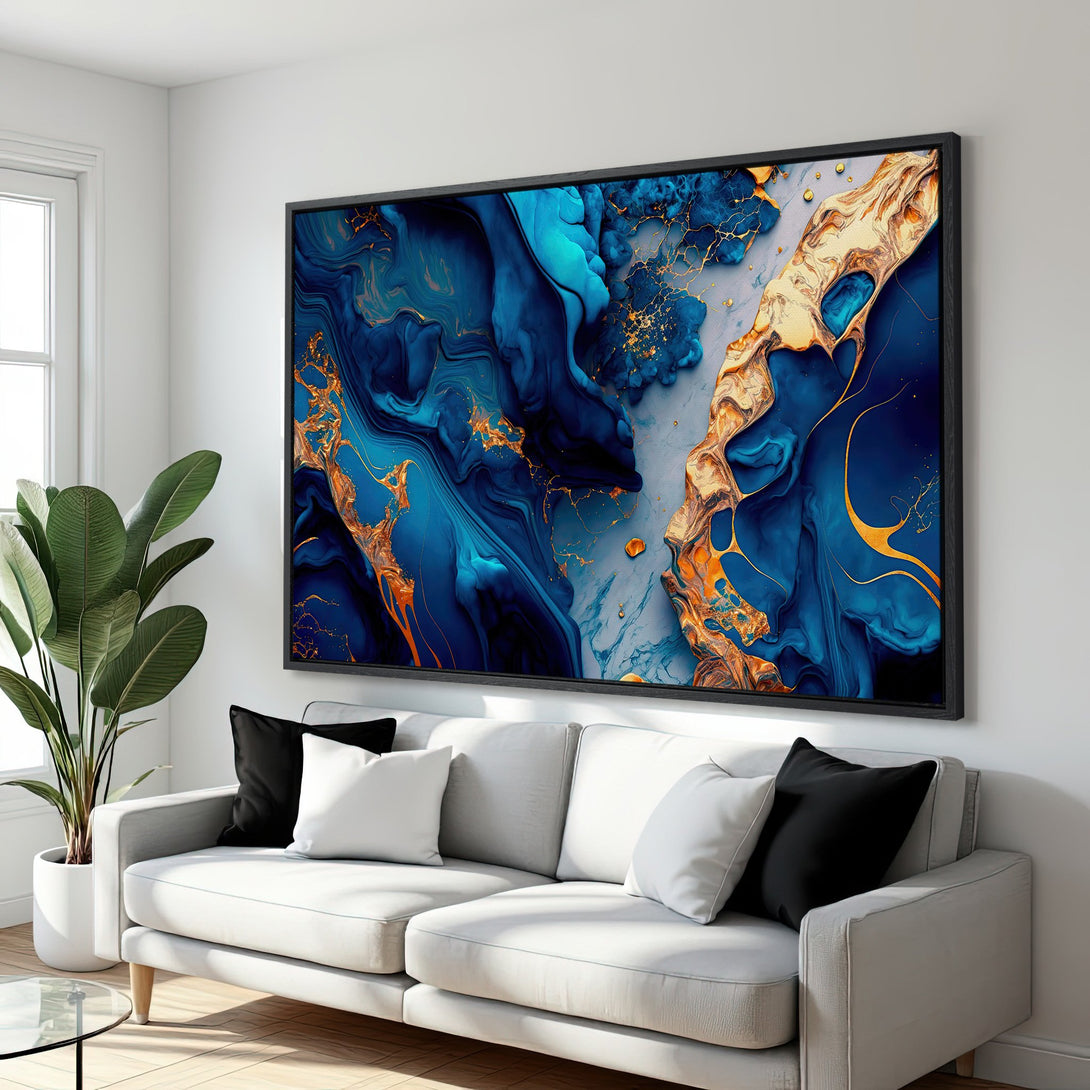 Framed Wall Art: Abstract blue and gold canvas print. Modern art with flowing design, perfect for living room decor. Adds a touch of elegance.