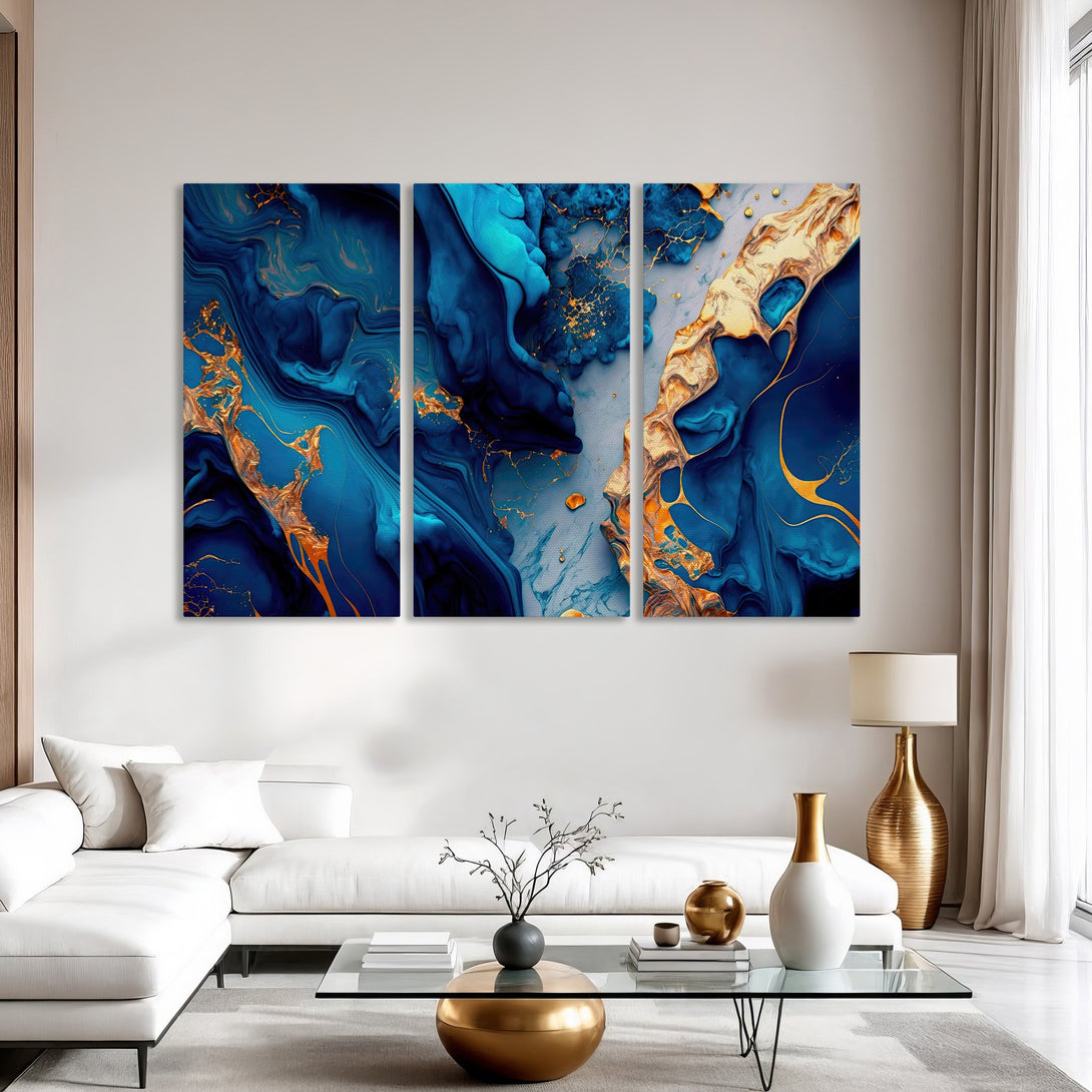 Abstract Canvas Print triptych in blue and gold tones. Modern wall art perfect for living room decor. Elevate your space with this stunning piece!