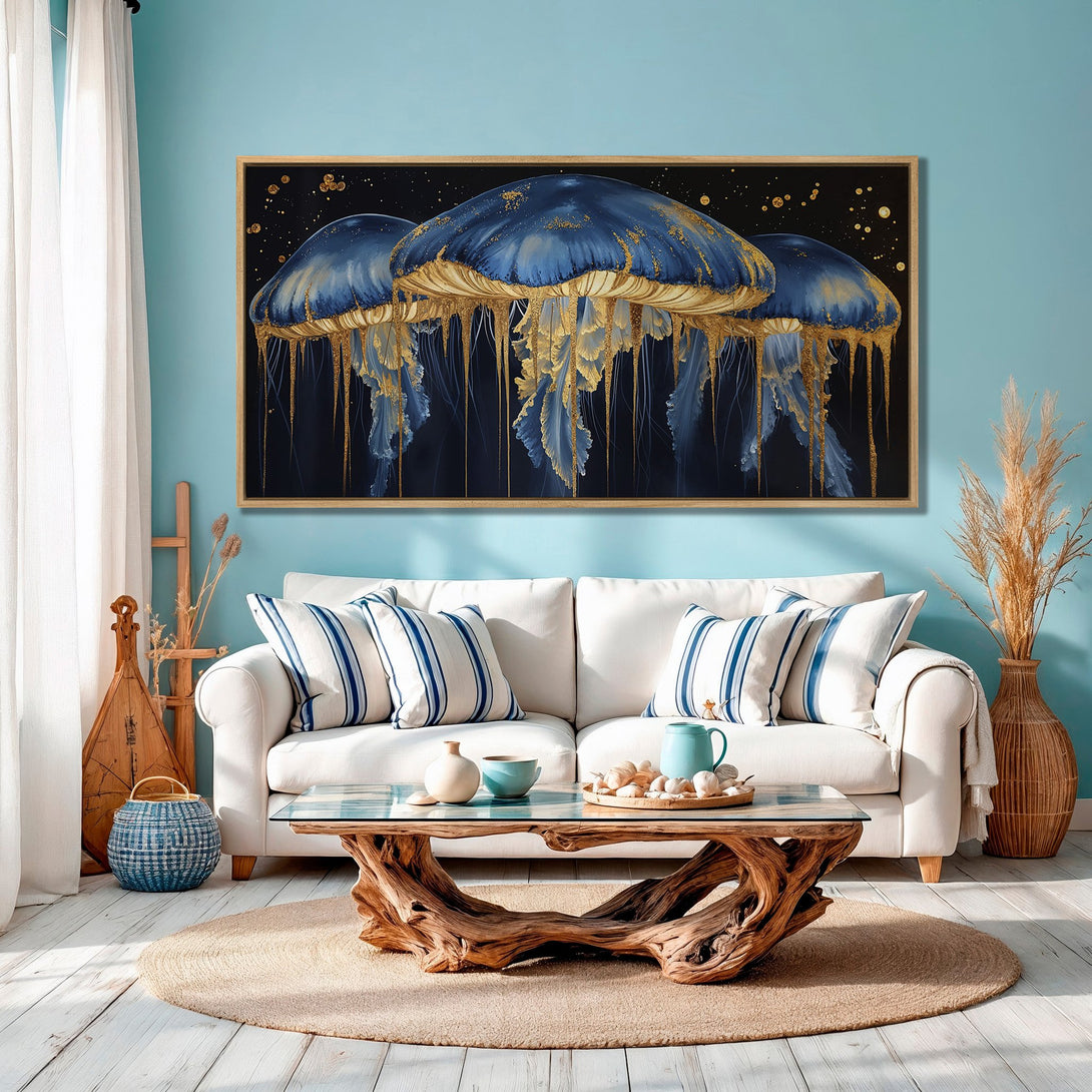 Framed Wall Art: Elegant blue & gold jellyfish canvas print. Coastal style art with a dark, moody background and gold accents. Perfect for living room decor.