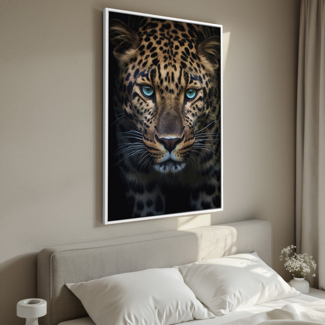 Framed Wall Art: Stunning leopard portrait with striking blue eyes. Earthy tones and a modern style create a captivating focal point for any room. Shop now!