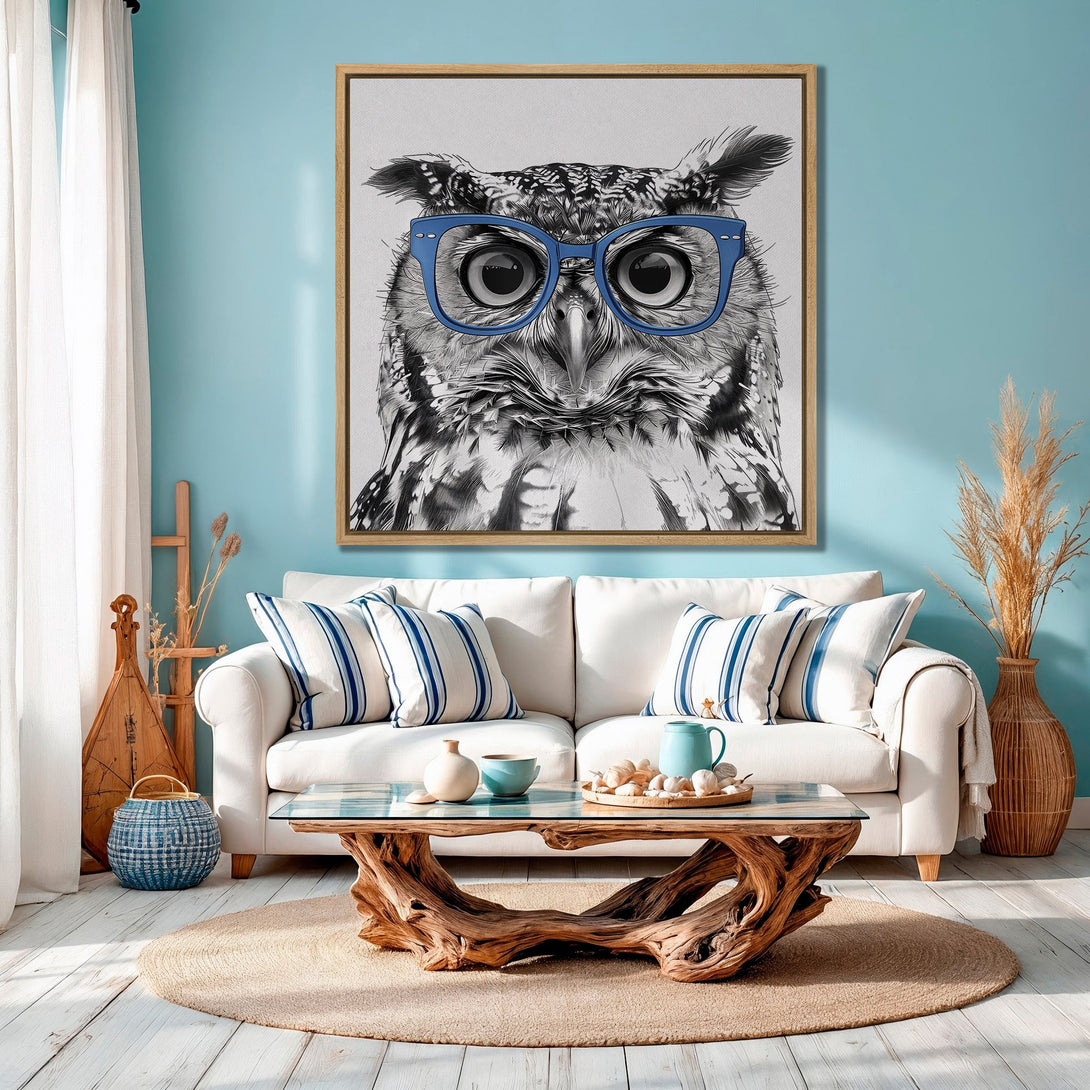 Framed Wall Art featuring a stylish owl wearing glasses, black and white illustration with blue accents, displayed in a coastal-themed interior.