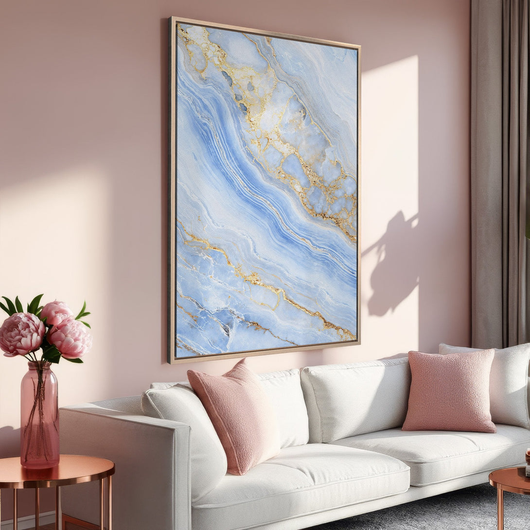 Framed Wall Art featuring a blue and gold abstract design. Modern art in a soft, pink interior. Perfect for adding a touch of elegance to your space.
