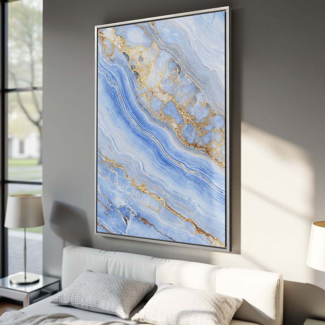 Framed Wall Art featuring a blue and gold abstract marble design. Modern Canvas Print in a bedroom setting, perfect for adding a touch of elegance.