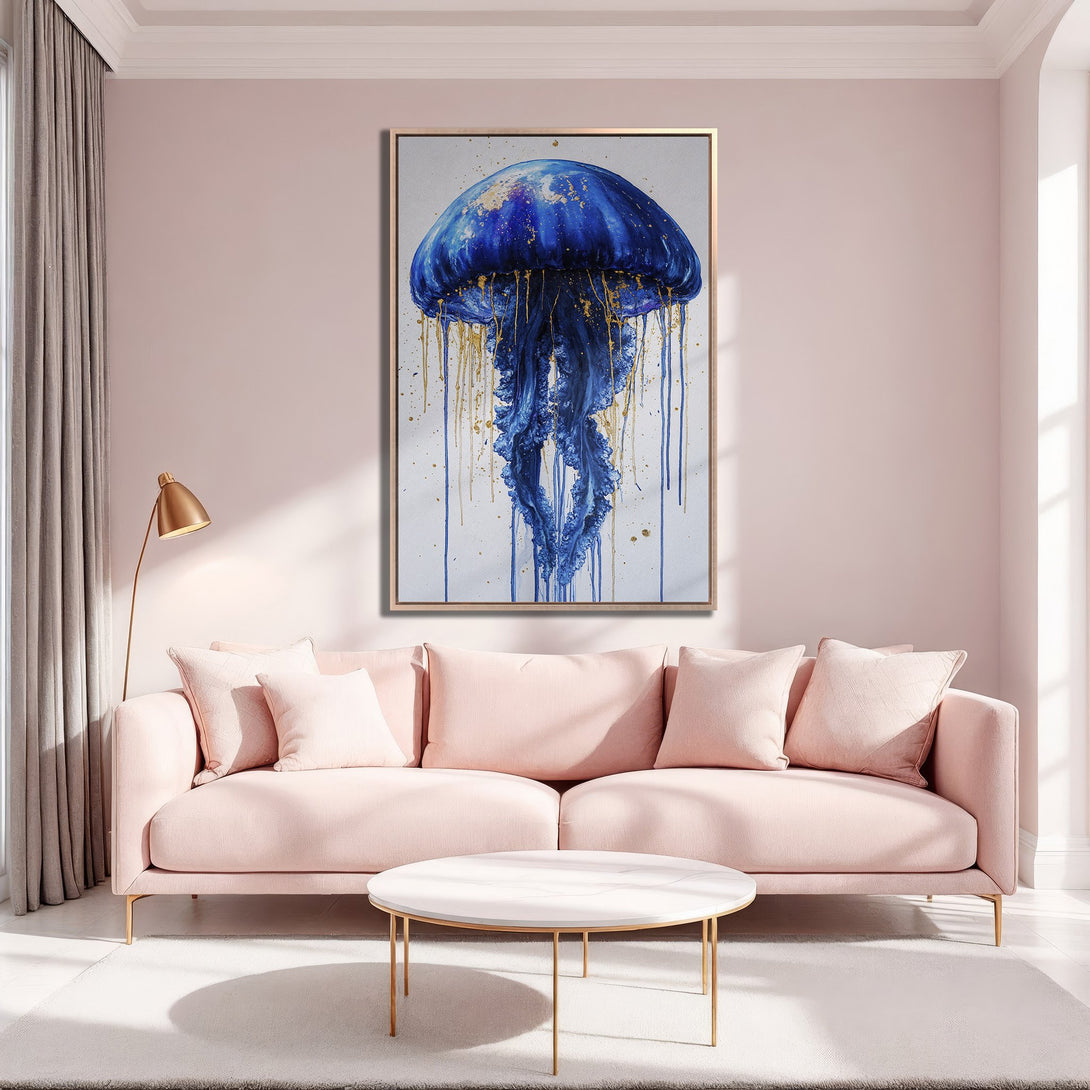 Framed Wall Art featuring a vibrant blue jellyfish with gold accents, displayed in a modern interior with a soft pink color palette.