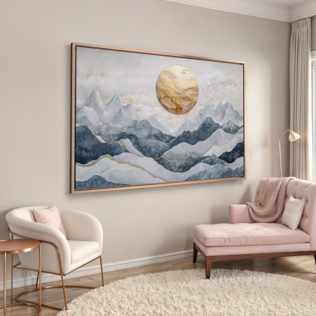 Framed Wall Art featuring a mountain landscape with a gold sun, in a calming blue and gold palette. Perfect for modern home decor.