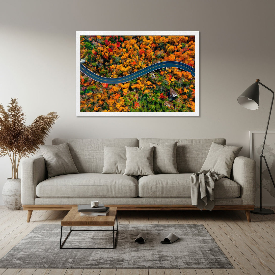 Framed Poster of winding road through vibrant autumn forest. Warm orange, red, and green color palette. Perfect wall art!