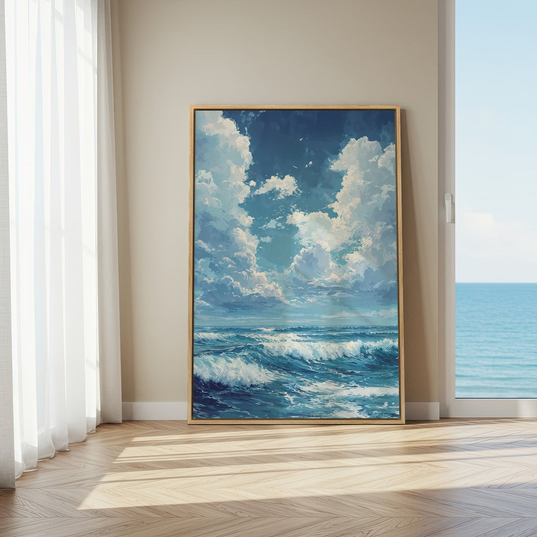 Framed Wall Art: Ocean wave painting in blue and white, displayed in a bright interior. Coastal art perfect for adding a serene touch to your home decor.