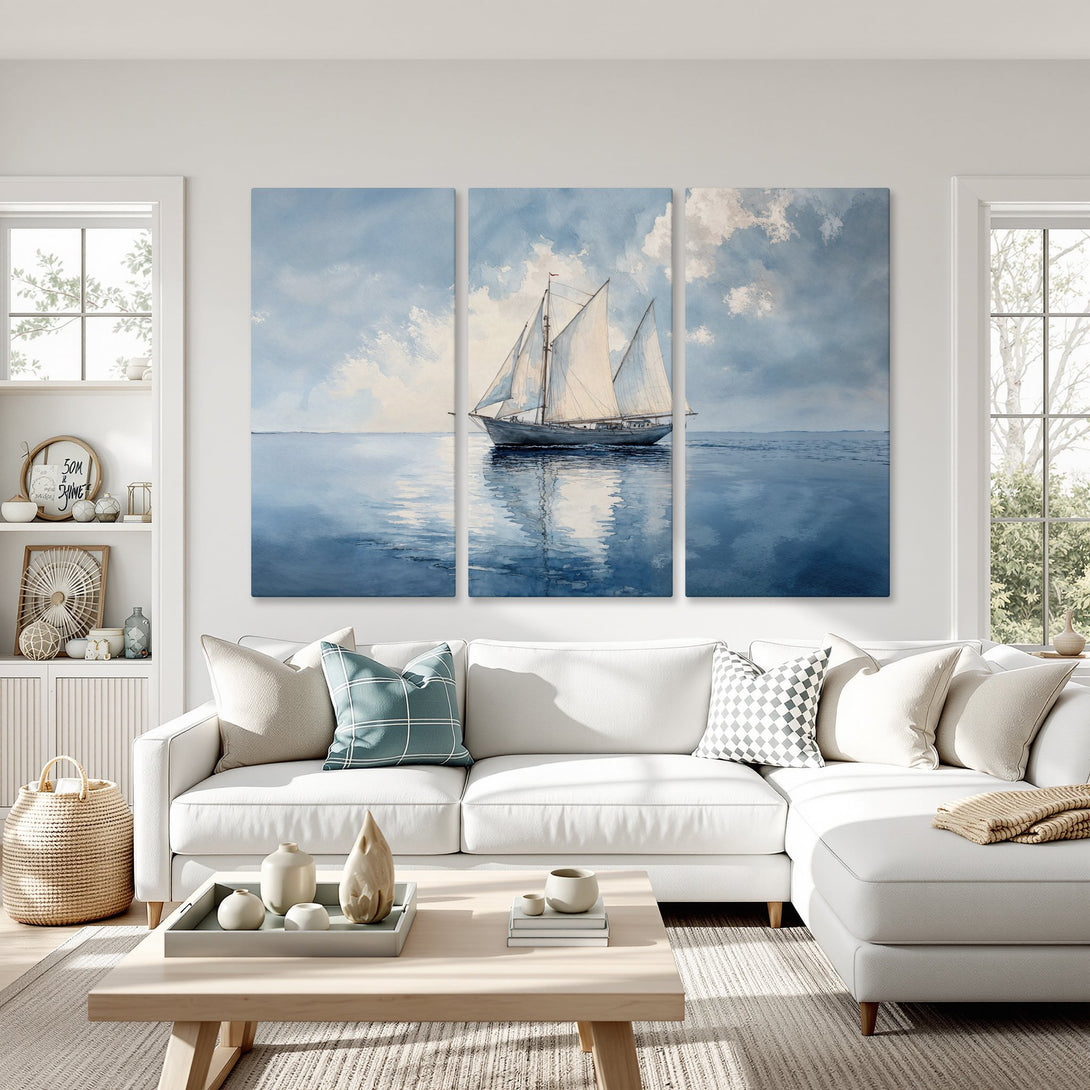Canvas Print of a sailboat on the sea in a watercolor style, blue and white color palette. Coastal wall art for a serene living room.
