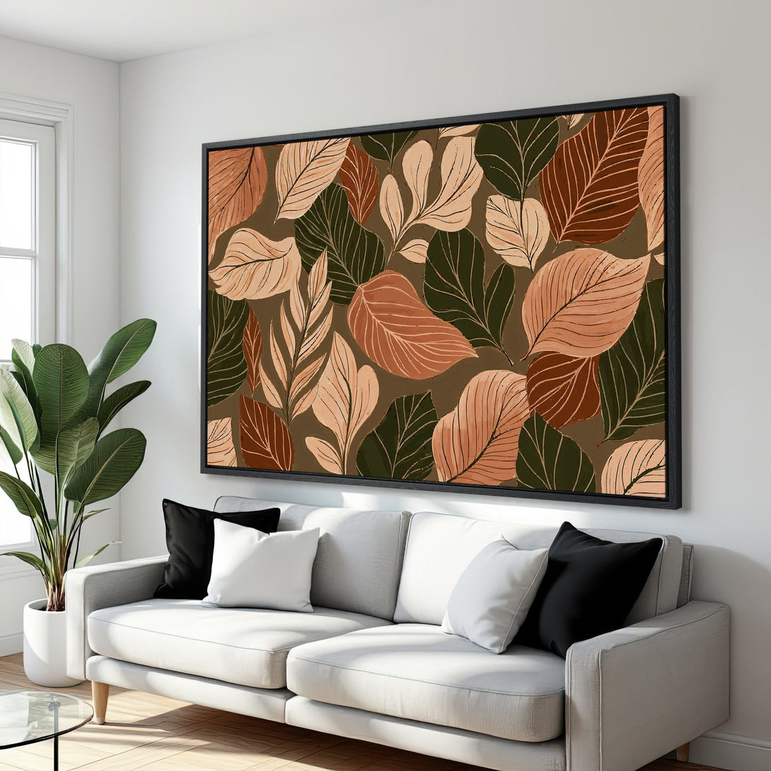 Framed Wall Art featuring a botanical leaf pattern in warm earth tones. Modern decor accentuates a stylish living room.