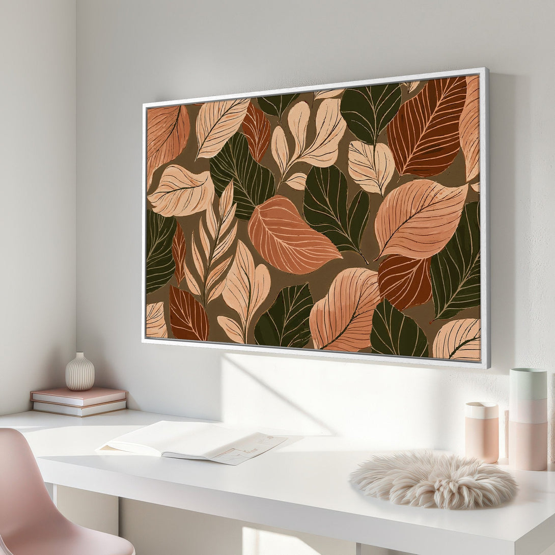 Framed Wall Art featuring a botanical leaf design in earthy tones of green, brown, and peach. Perfect for adding a touch of nature to your home decor.