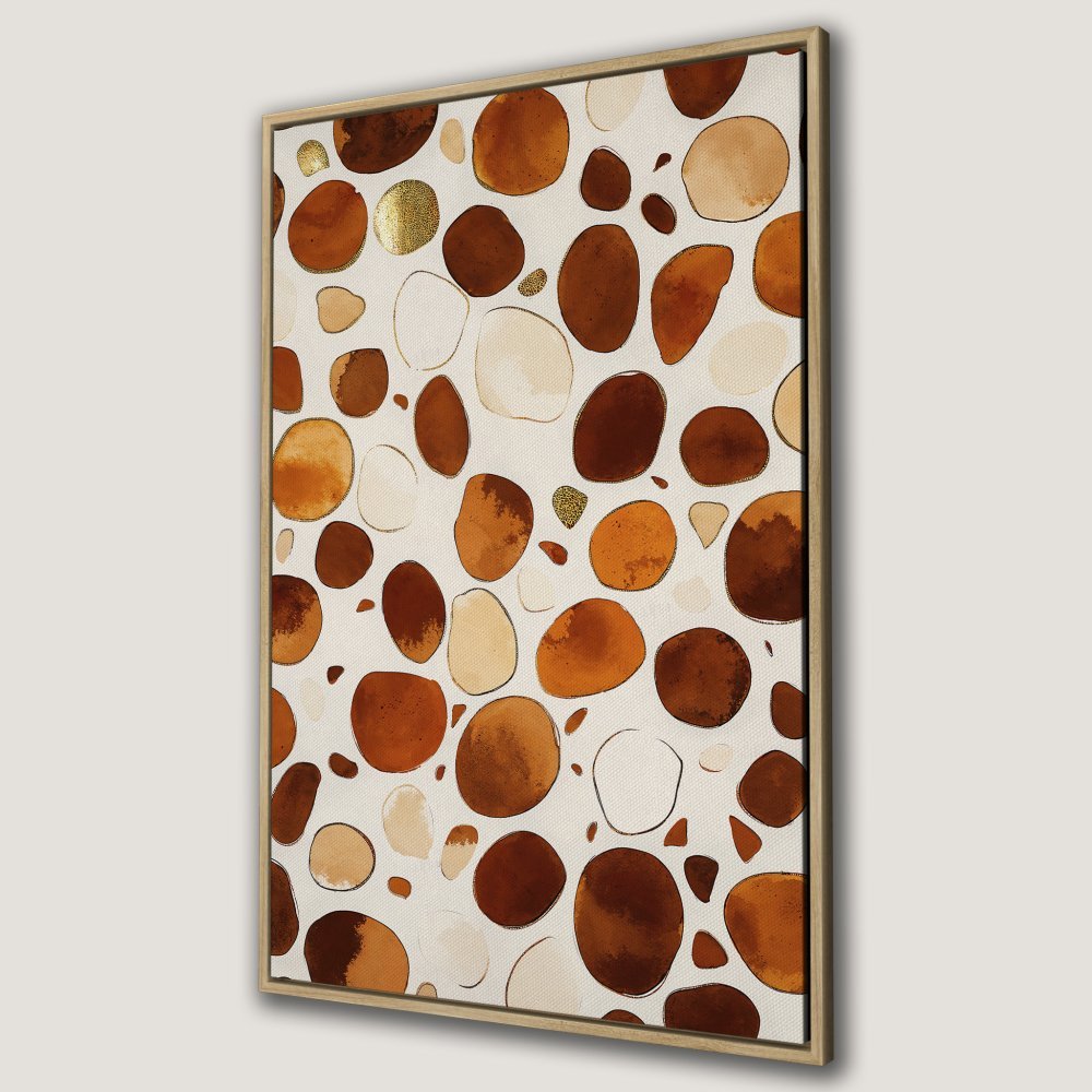 Framed Wall Art featuring an abstract pebble design in warm brown, beige, and gold tones. Perfect for adding a touch of modern art to your home.