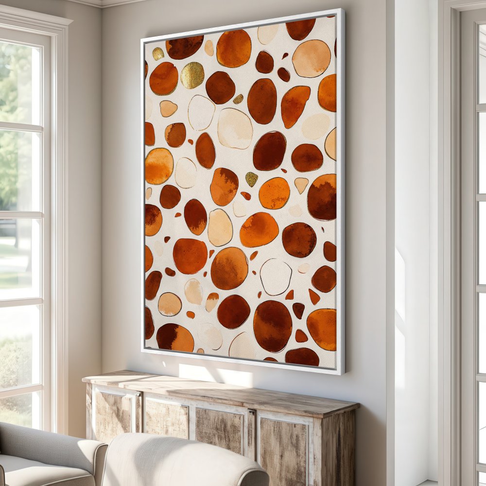 Framed Wall Art featuring abstract pebble design in warm orange and brown tones. Modern art perfect for any interior.