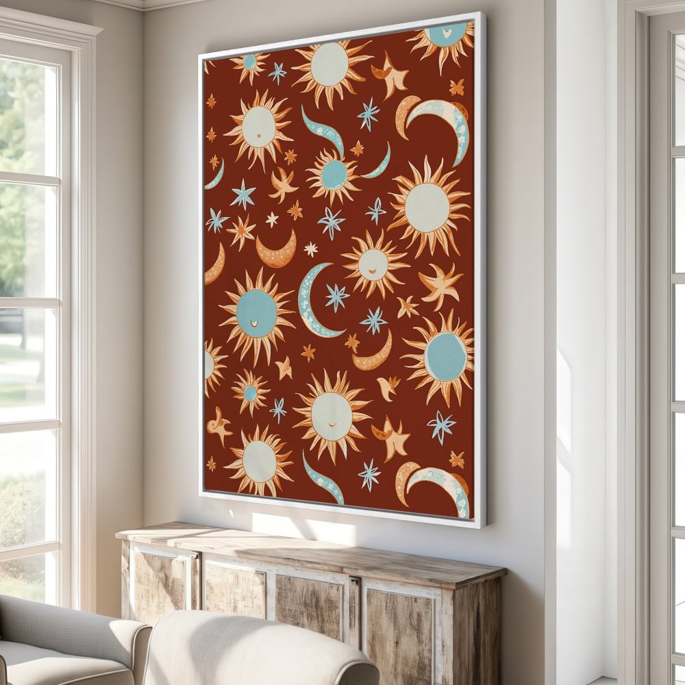 Framed Wall Art featuring a boho sun and moon pattern in terracotta, blue, and orange. Perfect for adding a touch of celestial charm to any room!