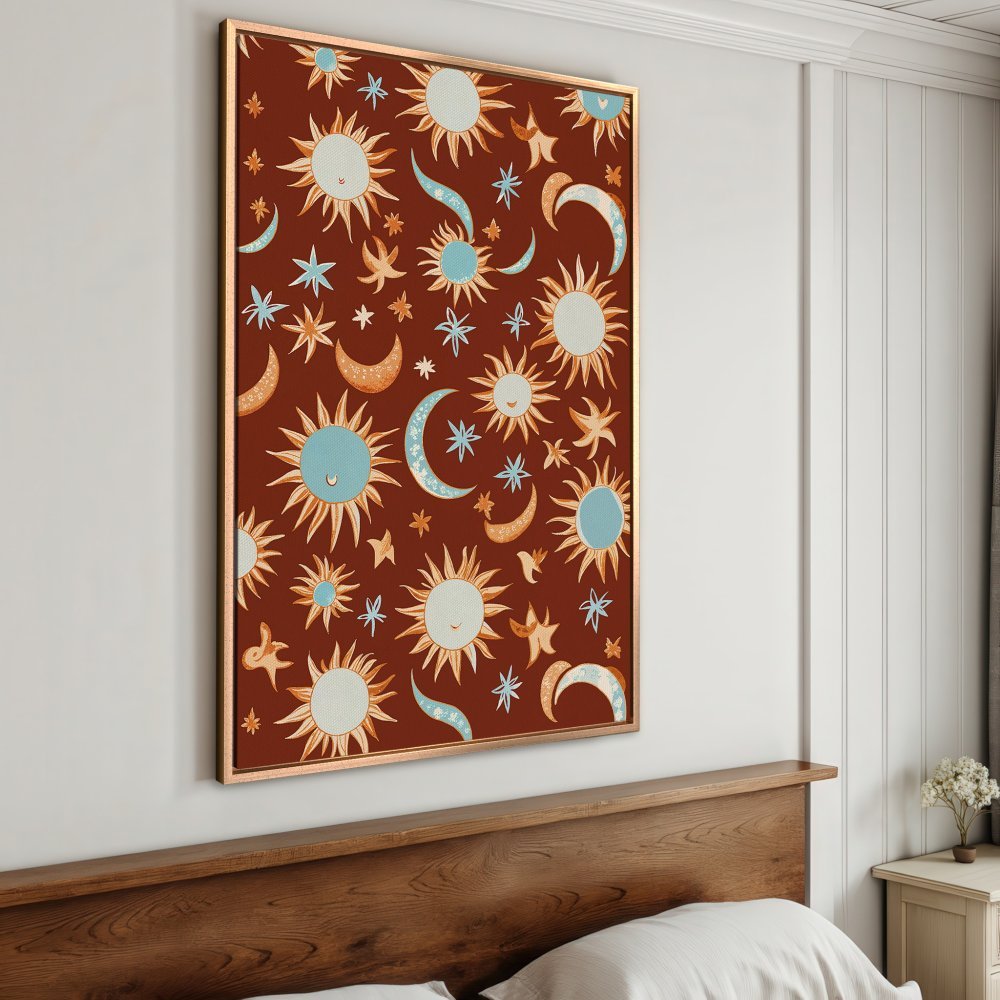 Framed Wall Art: Boho celestial print with suns, moons, and stars in terracotta, blue, and cream. Perfect for adding whimsical charm to your space.
