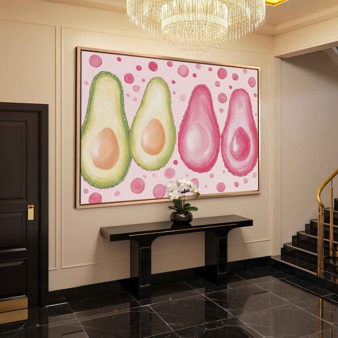Framed Wall Art featuring watercolor avocado halves in pink and green hues. Modern art for a stylish interior.
