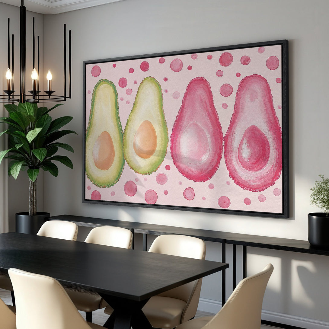 Framed Wall Art: Watercolor avocado print in pink and green hues. Modern, playful design for kitchen or dining room decor. Shop now!