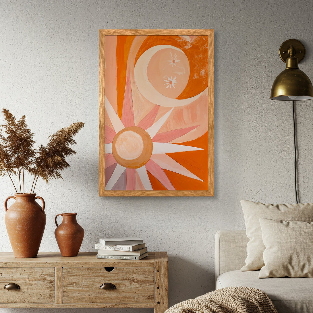 Framed Poster featuring a sun and moon abstract art in warm orange and pink tones. Perfect for adding a touch of boho style to your home decor.