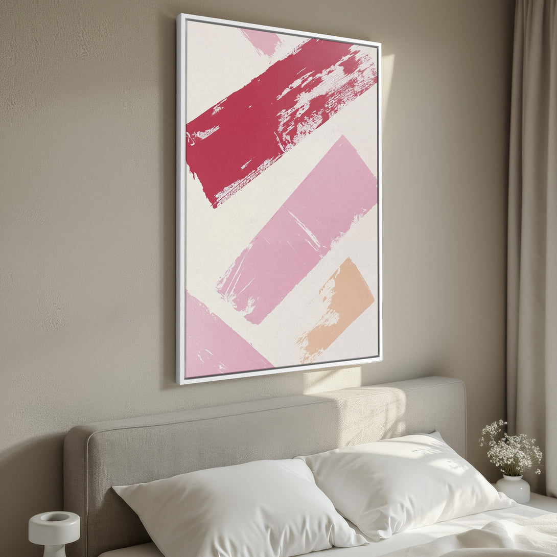 Framed Wall Art featuring abstract brushstrokes in pink and red hues. Modern art canvas print for bedroom decor. Adds a pop of color!