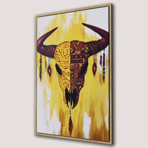 Framed Wall Art: Tribal bull skull canvas print. Bold yellow & red palette, bohemian style. Perfect statement piece for your home decor.