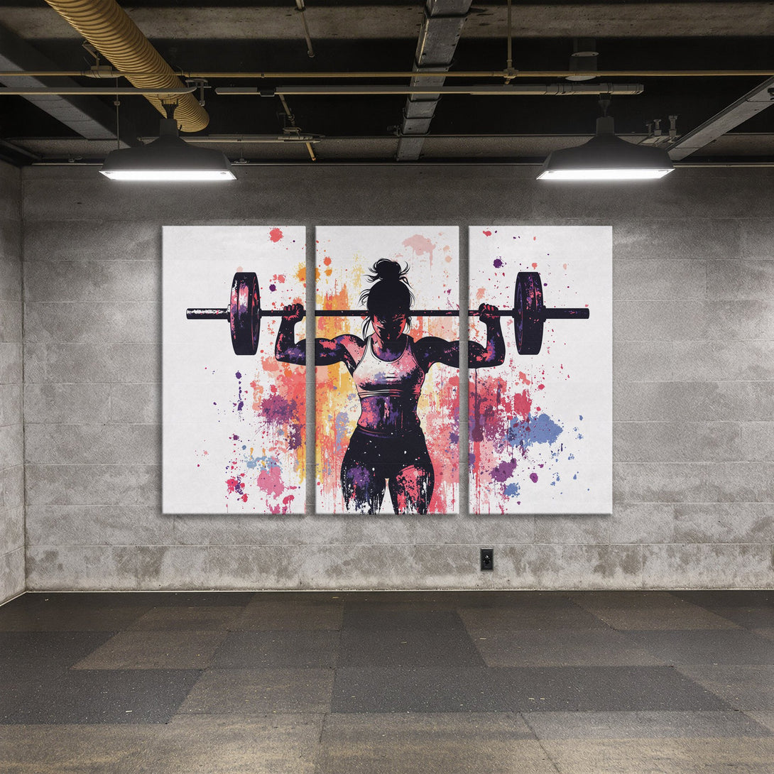 Canvas Print of a weightlifting woman, vibrant watercolor style with pink, purple, and orange splashes. Perfect for gym decor or fitness enthusiasts.