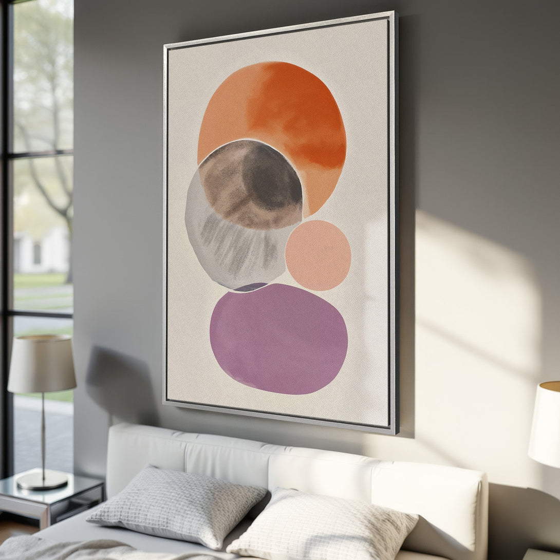 Framed Wall Art featuring abstract watercolor circles in orange, brown, gray, pink, and purple. Modern art print perfect for bedroom decor.