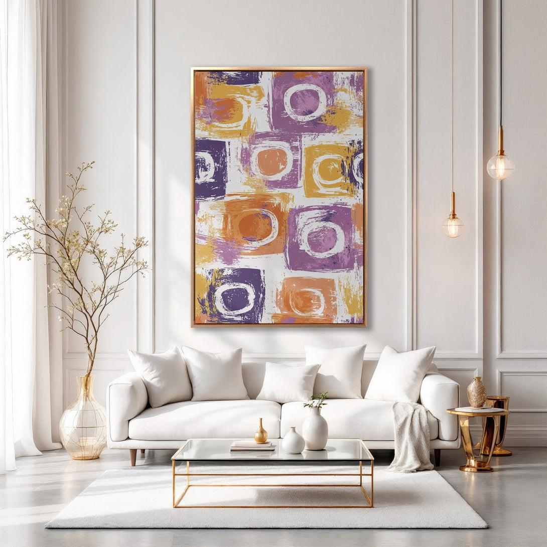 Framed Wall Art: Abstract brushstroke design in purple, orange, and yellow. Modern Canvas Print adds a pop of color to a stylish living room.