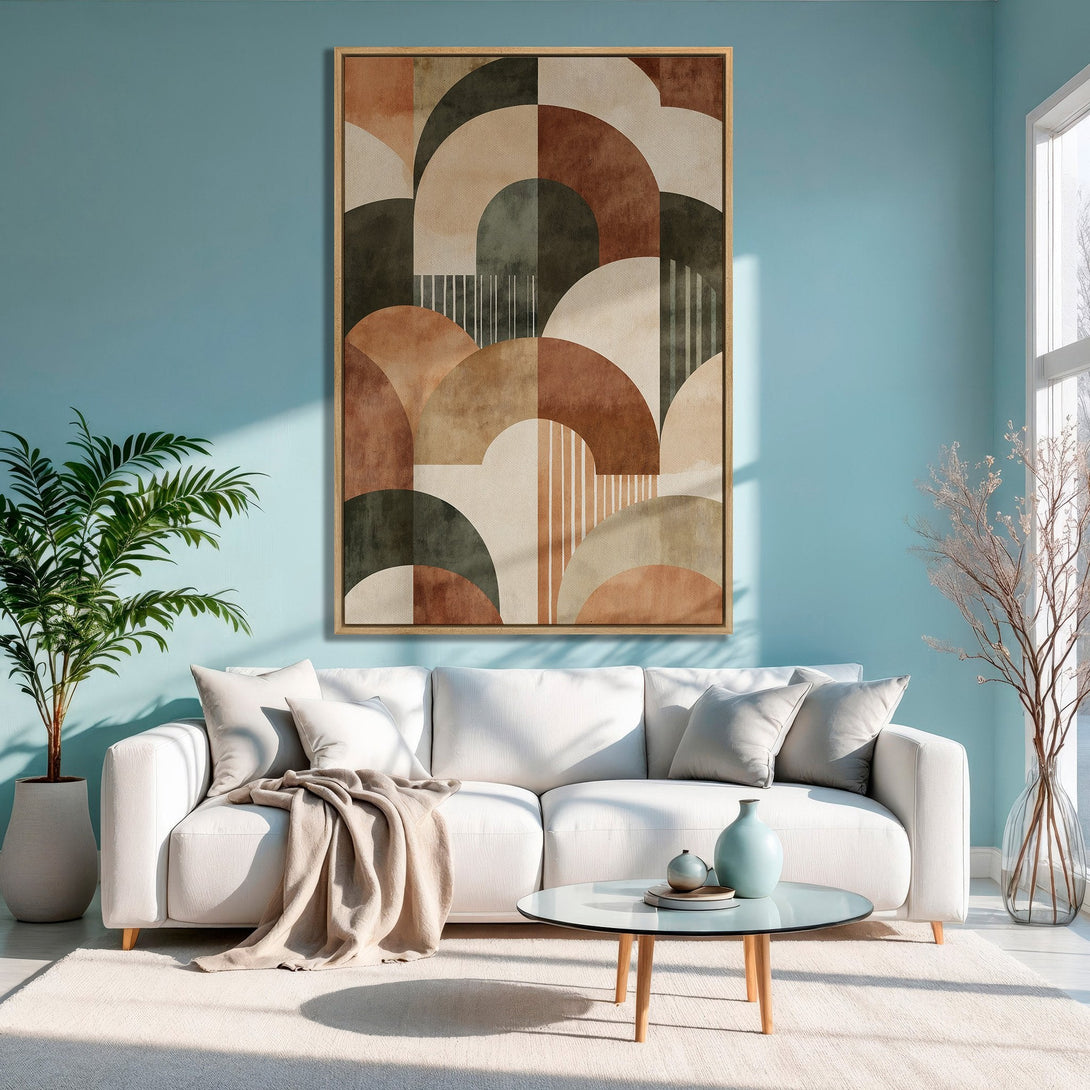 Framed Wall Art: Abstract geometric design in warm earth tones. Modern canvas print adds a stylish touch to a living room with a blue wall.