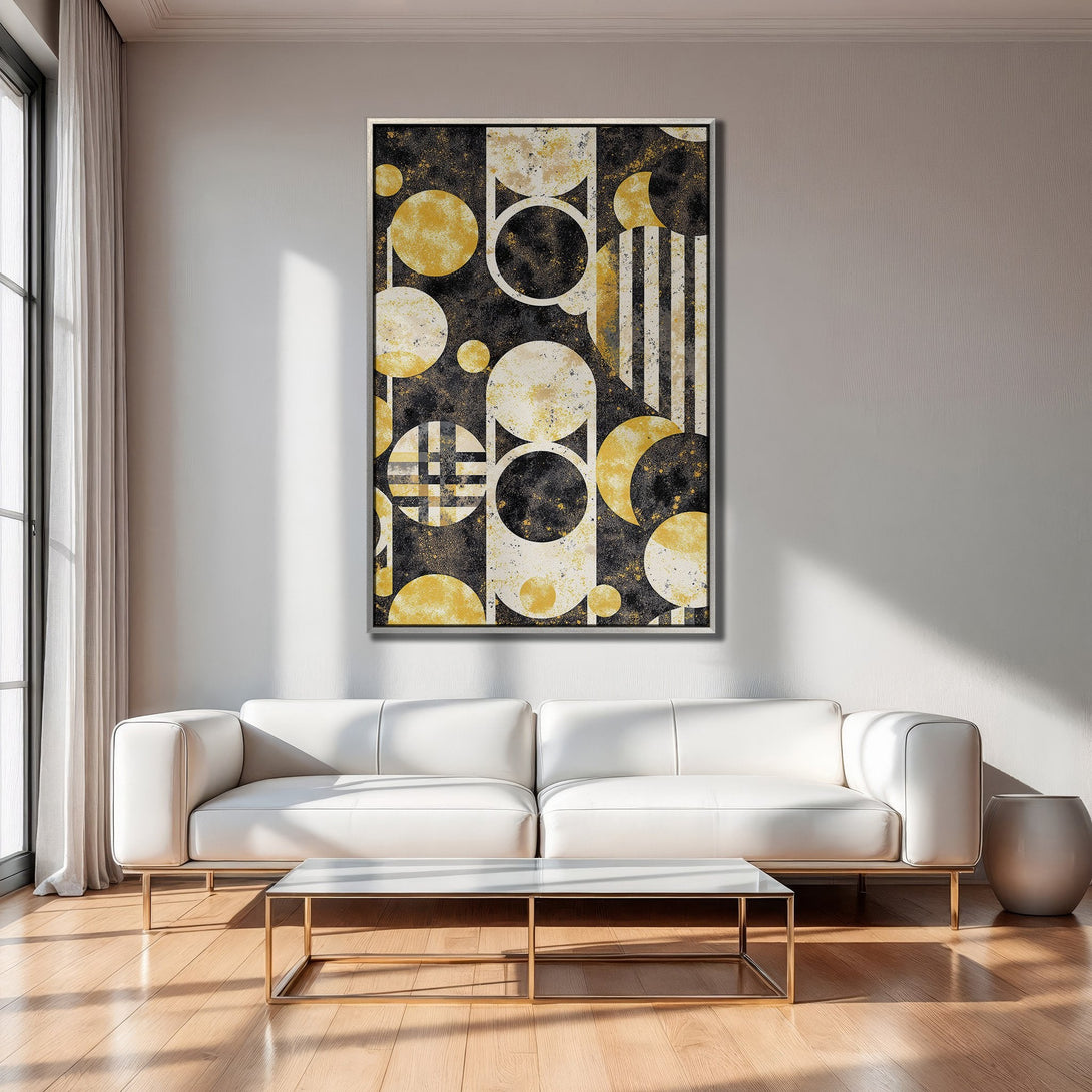 Framed Wall Art featuring a modern abstract geometric design in black, gold, and white, displayed in a stylish living room.